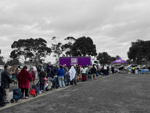 Image of man in kitchen with text overlayed saying 3.4 million households in Australia are food insecure