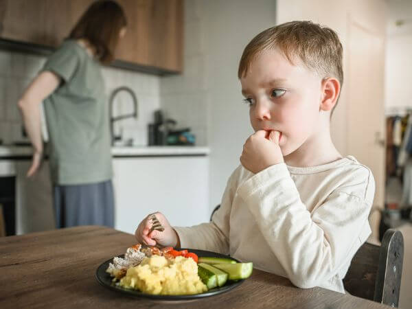 Image of man in kitchen with text overlayed saying 3.4 million households in Australia are food insecure